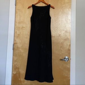 Sleeveless black dress.
